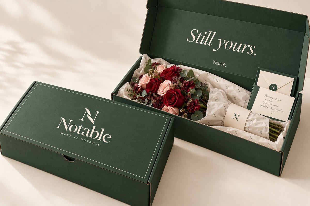 The forest-green Notable box with the ivory wordmark