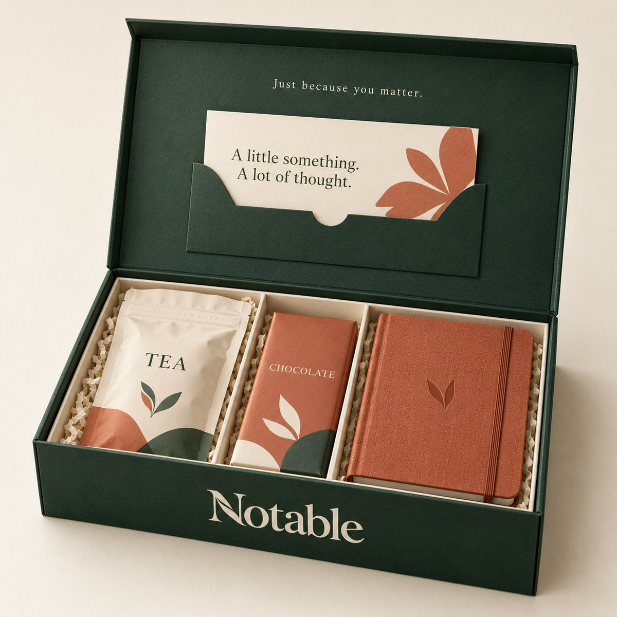 A Little Notable gift hamper in a forest-green Notable keepsake box