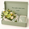 A Quiet Lift bouquet in its sage Notable box