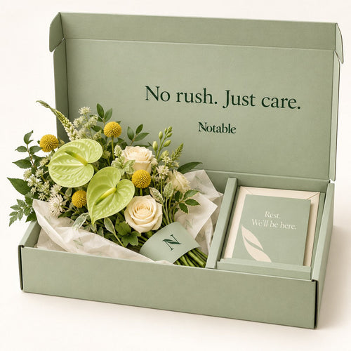 A Quiet Lift bouquet in its sage Notable box