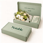 Gentle Company bouquet in its sage Notable box, closed box and open box