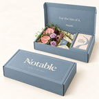 Pink Detour bouquet in its dusty blue Notable box, closed box and open box
