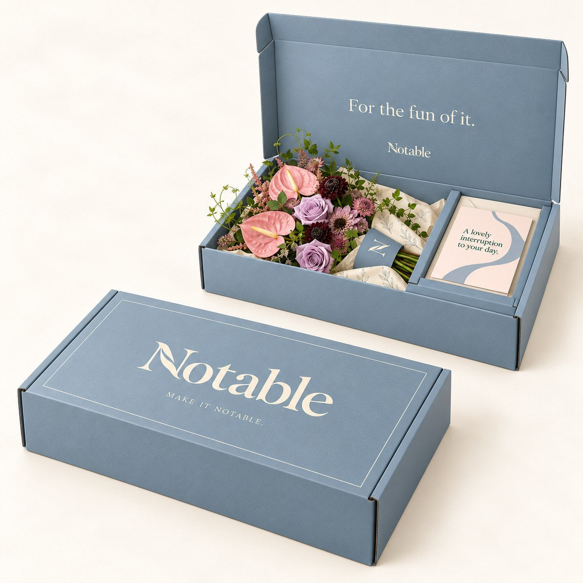 Pink Detour bouquet in its dusty blue Notable box, closed box and open box