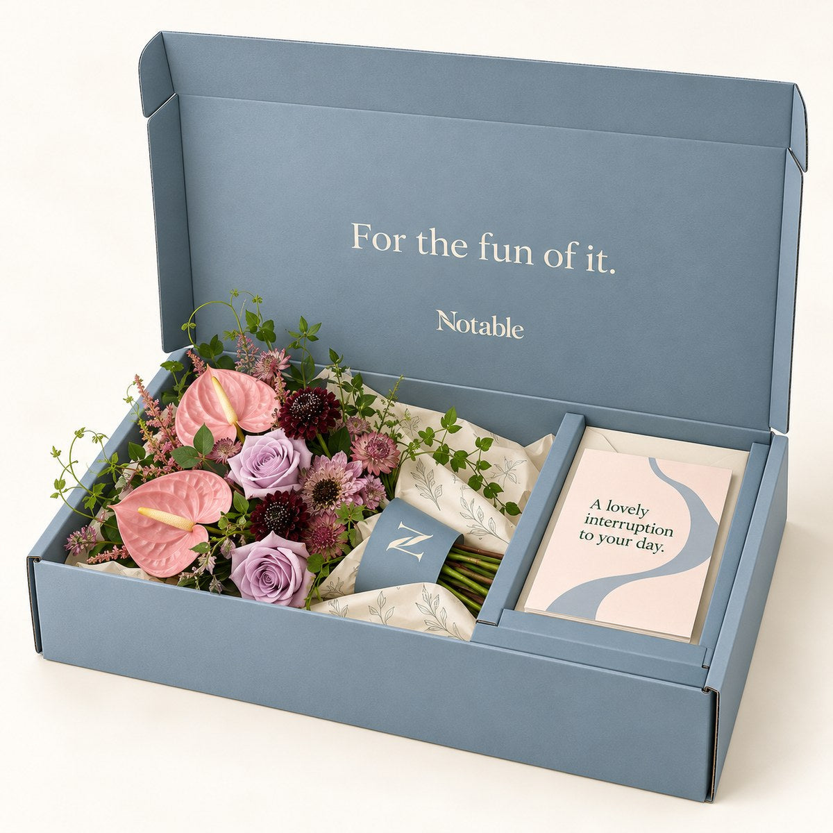 Pink Detour bouquet in its dusty blue Notable box